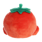 Plush toy shaped like a tomato with green stem on a white background