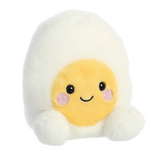 Plush toy shaped like a fried egg with a smiling face on a white background