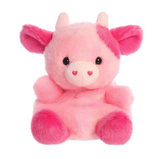 Pink plush toy cow with heart eyes on a white background