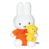 Plush toy rabbit wearing an orange outfit holding a yellow teddy bear on a white background