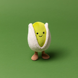 Plush toy resembling a pod with a smiling face on a green background