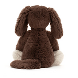 Brown plush dog toy on a white background