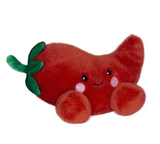 Plush toy shaped like a red chili pepper with a smiling face on a white background