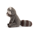 Plush toy raccoon on a white background