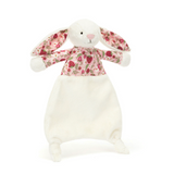 Plush bunny toy with floral pattern on a white background