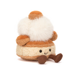 Small plush toy resembling a character with a white body, brown hat, and boots on a white background