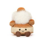 Plush toy resembling a s'more with a face on a white background