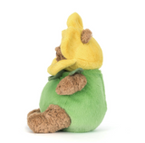 Plush toy resembling a green mushroom with a yellow cap on a white background