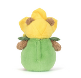 Plush toy resembling a yellow flower with green leaves on a white background