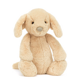 Plush toy rabbit in beige color on a white background
