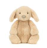 Beige plush bunny toy on a white background