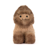 A small plush lion toy with a fluffy brown mane and a lighter tan body, sitting against a plain white background.