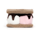 A plush toy designed to look like a s'mores sandwich, featuring soft brown faux-chocolate marshmallows in white and pink, sandwiched between brown faux-sesame cookie halves, on a solid white background.