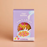 Box of Tiny Harlow Tiny Loops cereal on a beige background