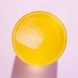 Yellow ceramic bowl on a light pink background