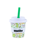 Children's cup with dinosaur pattern and green straw on a white background