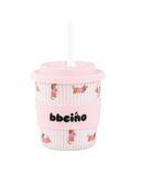 Pink cup with a straw and 'bbeeino' branding on a white background
