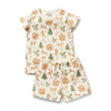 Children's pajama set with gingerbread man and tree pattern on a white background