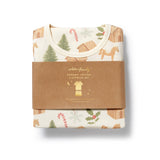 Packaged organic cotton sleepwear set with Christmas-themed design on a white background