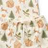Christmas-themed pajama shorts with gingerbread men, trees, and holly leaves on a white background.