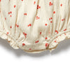 Baby romper with red floral pattern on a white background