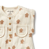 Baby onesie with gingerbread man pattern on a white background