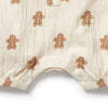 Baby romper with gingerbread man pattern on a white background