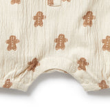 Baby romper with gingerbread man pattern on a white background