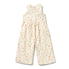 White sleeveless jumpsuit with red floral pattern on a white background