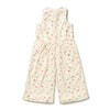 White sleeveless jumpsuit with red floral pattern on a white background
