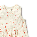 Beige dress with red floral pattern on a white background