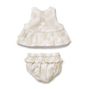 Baby dress and bloomers set on a white background