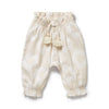 Beige baby pants with tassels on a white background