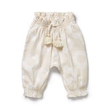 Beige baby pants with tassels on a white background