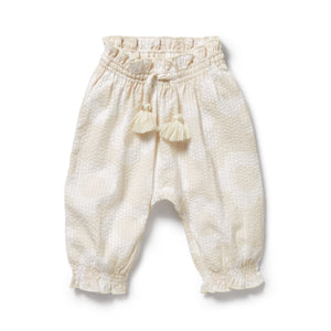 Beige baby pants with tassels on a white background