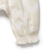 Close-up of a textured white fabric on a light gray background