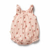Pink baby romper with strawberry pattern on a white background