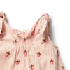 Pink sleeveless top with strawberry pattern on a white background