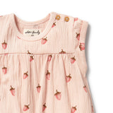 Baby dress with strawberry pattern and 'without a frill' branding on a white background
