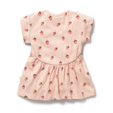 Pink dress with strawberry pattern on a white background