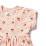 Pink dress with strawberry pattern on a white background
