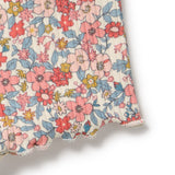 Floral fabric with pink, red, and blue flowers on a white background