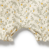 Floral-patterned fabric with yellow flowers and green leaves on a white background