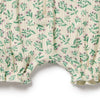 Floral-patterned fabric with green leaves and pink flowers on a white background