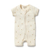 Baby romper with gold floral patterns on a white background