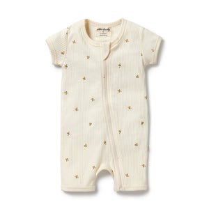 Baby romper with gold floral patterns on a white background