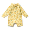 Yellow children's swimsuit with lemon pattern on a white background