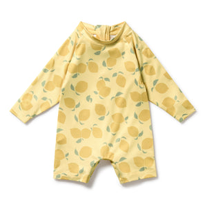 Yellow children's swimsuit with lemon pattern on a white background