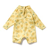 Yellow baby romper with lemon pattern on a white background