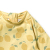 Yellow children's shirt with lemon pattern on a white background